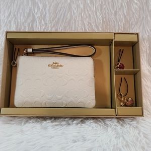NEW with no Tag Coach corner zip wristlet with 2 detachable charms
